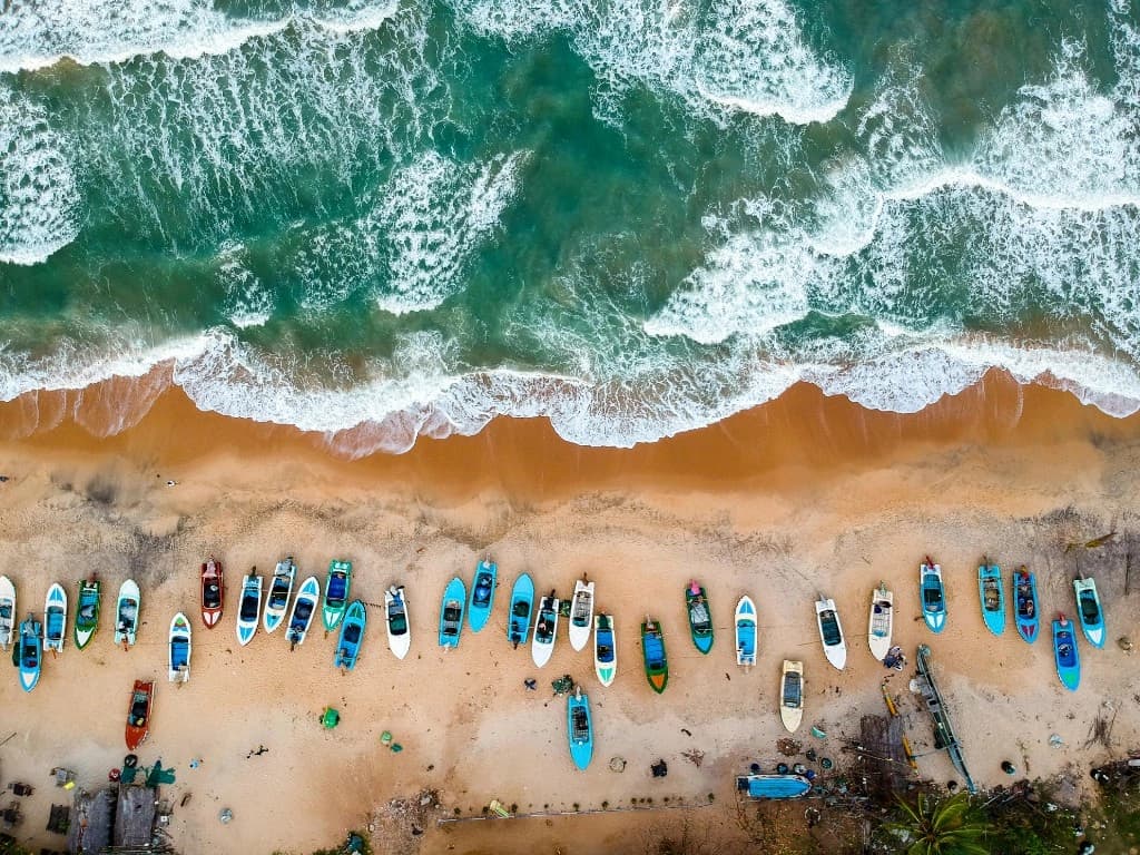 Ella & the hills — Aerial view of colourful fishing boats along the Sri Lankan coast