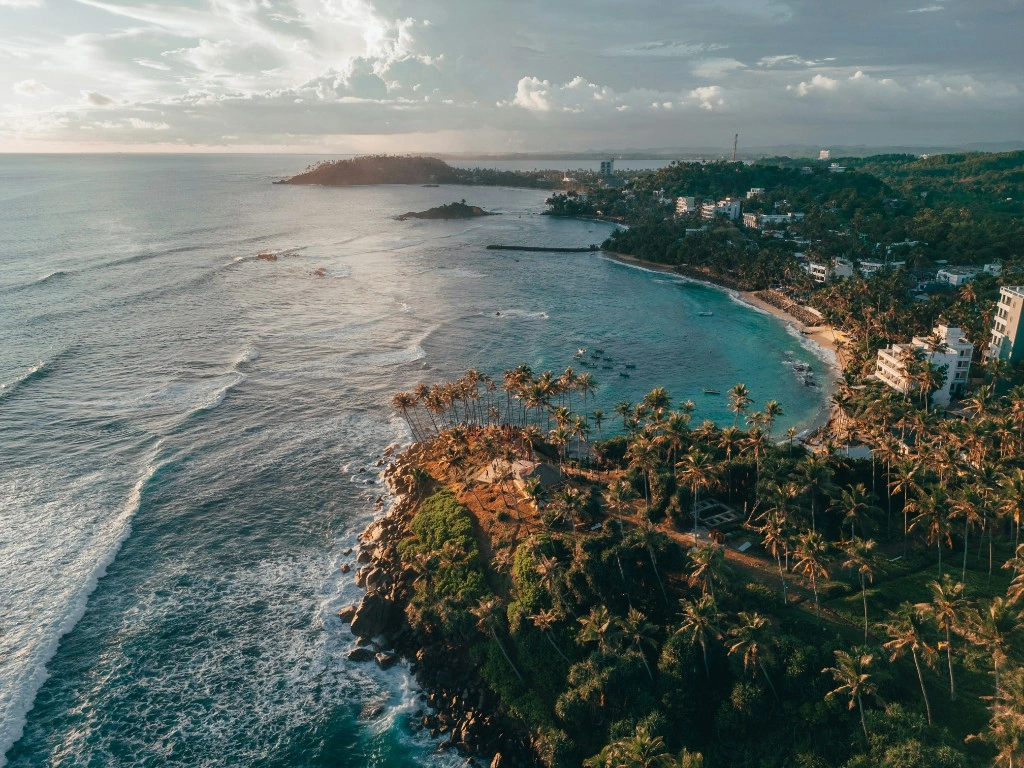 Aerial view of Sri Lanka's south coast beach and turquoise shallows